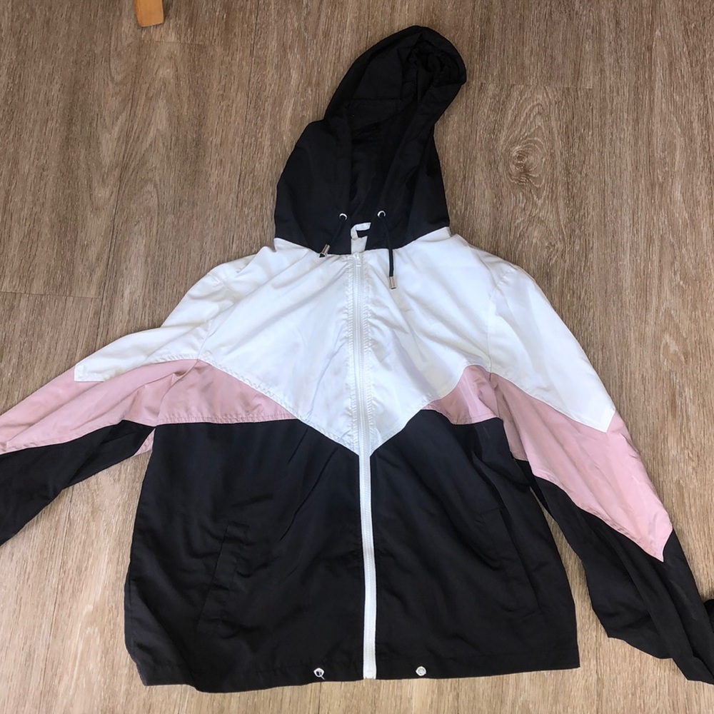 Pink, Black, and White windbreaker.